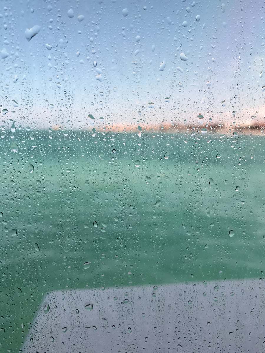 water drops dewdrops on glass window selective-focus photography at daytime wet